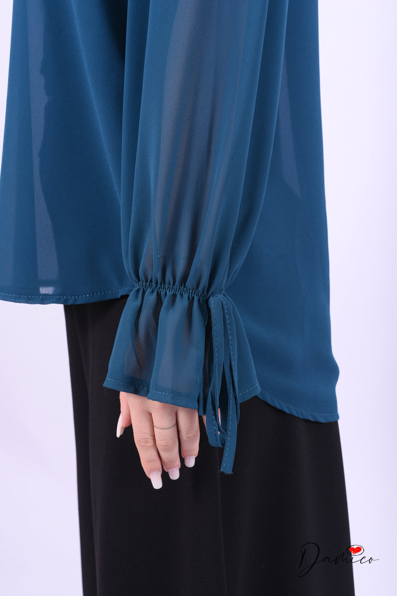 Blusa con fiocchetti