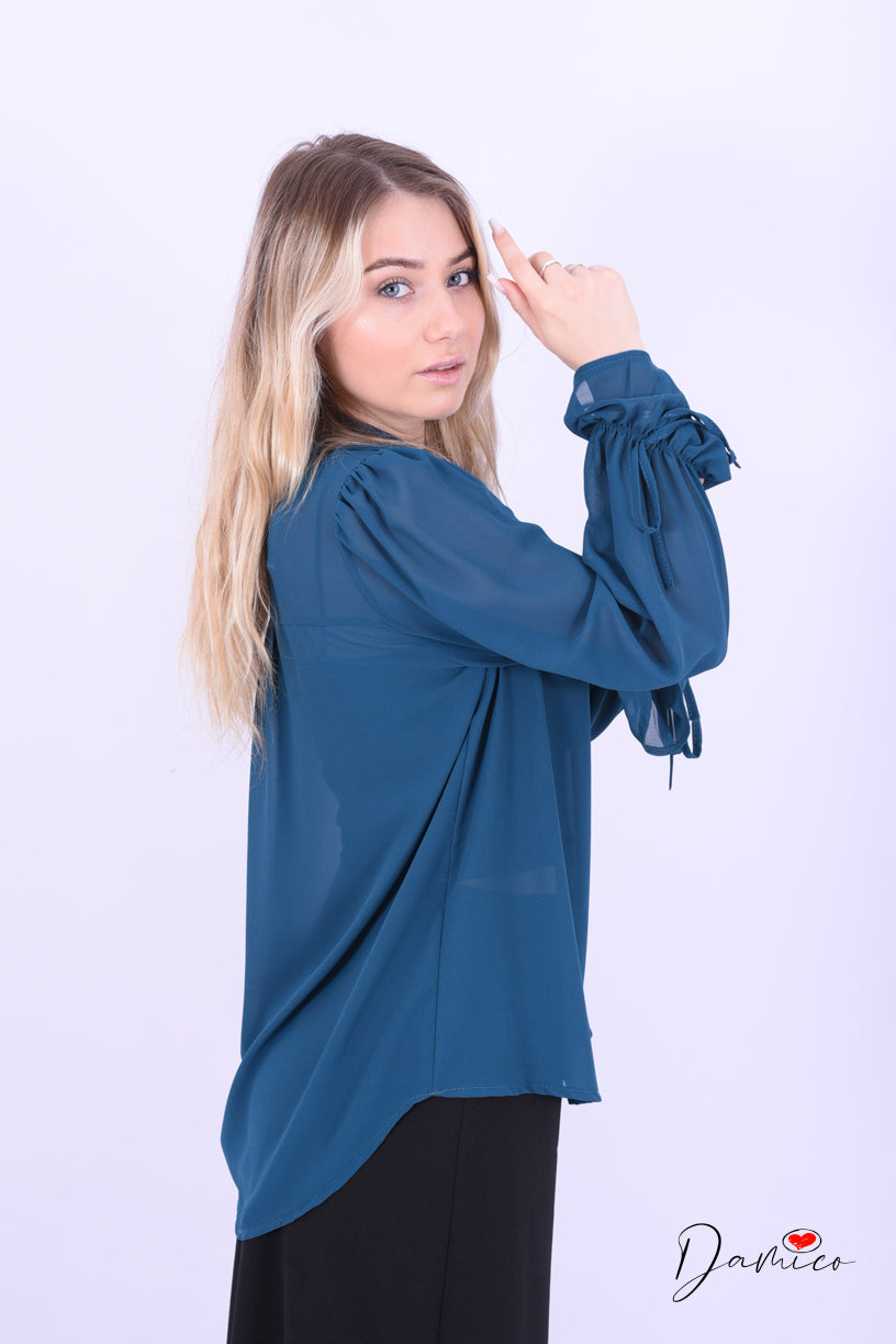 Blusa con fiocchetti