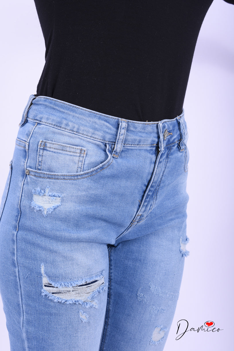 Jeans strappati con risvolto