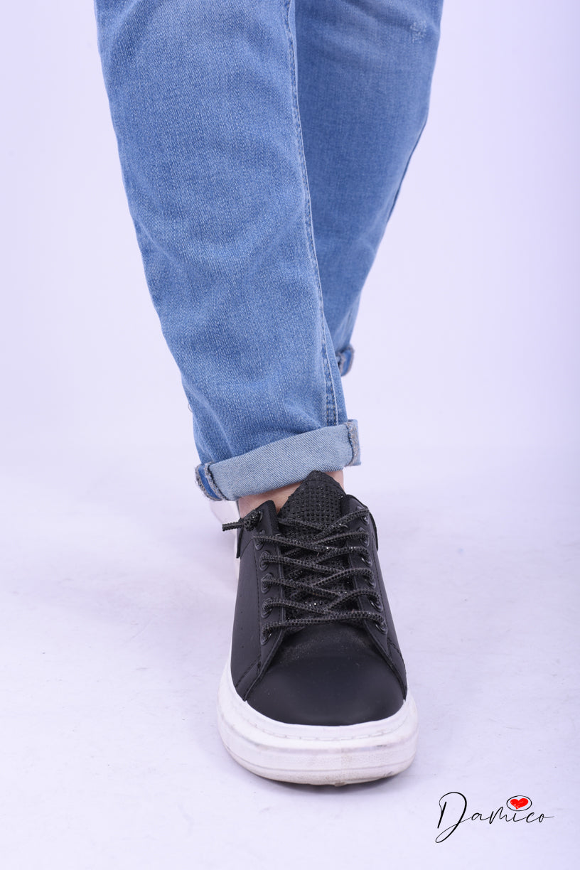 Jeans strappati con risvolto